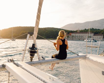 Mediterranean yacht charter woman on bow of boat